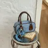 Bolsa de bowling casual de mezclilla, nuevo modelo de invierno 2026, elegante y simple, de un solo hombro, de mano, cruzada para mujer