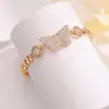 Pulsera de Zirconia con Mariposa de Círculo Hueco Redondo de Gran Venta, Diseño de Nicho Minimalista Transfronterizo, Joyería Exquisita para el Día a Día