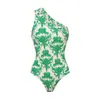Traje de baño de alta gama nuevo europeo y americano, traje de baño de una pieza verde estampado de un solo hombro, traje adelgazante para mujeres de talla grande, producto popular transfronterizo