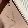 Xiaohongshu Más Vendido Nuevo Estilo Chino Anillo de Correr Forma de Cacahuete Cristal Amarillo Pulsera Collar Conjunto de Joyería de Ojo de Gato Venta al por Mayor