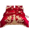 Lujoso juego de cuatro piezas de color rojo brillante para boda, algodón puro con bordado de dragón y fénix, sábana bajera y funda de edredón, ropa de cama para boda