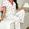 2026 estilo nuevo ropa de casa estampada cuello en V manga corta pantalón largo conjunto de pijama de dos piezas ropa de estar cómoda 7066