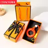 Chaveiro de anel de aperto criativo transfronteiriço para alívio de estresse, mini treinador de dedos colorido, dispositivo de aperto para alívio de estresse, pingente de mochila