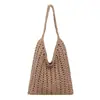 Bolsa tejida de gran capacidad transfronteriza para mujer, nuevo bolso de hombro versátil casual calado 2026, bolsa de playa estilo vacación costera