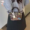 Bolso de mujer de un solo hombro 2026 casual pequeño cuadrado otoño nicho cuadros muñeca moda nuevo estilo bolso cruzado para ir al trabajo retro