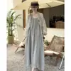 Vestido de tirantes casual de estilo coreano, ligero, de lujo, ultra-fairy para verano, combinado con una camisa con volantes para protección solar para mujer