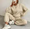 Conjunto de Duas Peças Europeu e Americano Transfronteiriço Primavera e Outono 2025 Novo Top Feminino de Tricô Torcido com Mangas Longas e Gola Redonda e Leggings