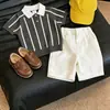 Traje para Niños 2026 Nuevo Estilo Coreano Fresco y de Moda Versátil Camisa Polo de Punto Rayada Pantalones Cortos Casuales Conjunto de Dos Piezas