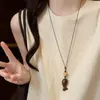 Nuevo collar colgante de pez de palisandro estilo chino, estilo étnico vintage, cadena larga versátil para suéter, accesorio de diseñador para mujer