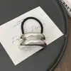 Europa y Estados Unidos transfronterizo simple metal brillante geométrico cuerda para el pelo simple Joker diseño sensación bola cuerda para el pelo mujeres al por mayor