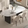 Mesa de comedor de piedra sinterizada de lujo ligero estilo crema de celebridad de internet para el hogar, mesa y sillas de comedor ovaladas negras minimalistas modernas, mesa de comedor para restaurante