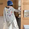Ropa para Niños Tongku 2026 Otoño Moderna Estampado de Dibujos Animados Estilo Coreano Rayas Suave Camiseta de Manga Larga para Niños