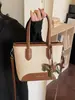 Bolso de mano tipo cubo nuevo de primavera 2026, transfronterizo, estilo vintage simple, de alta gama, moderno, para ir al trabajo, bolso de hombro cruzado de moda