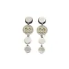Suministro exclusivo transfronterizo de Xiaoxiangjia de auténticos pendientes de borlas de colores contrastantes doble C con diamantes y etiquetas, diseño simple y elegante estilo Chanel