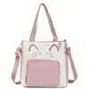 Bolso de tutoría estilo universitario, nuevo estilo japonés fresco, dulce, lindo gatito, bolso de hombro para niñas, ligero y portátil