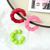 Pendientes de hielo de color mágico únicos de Europa y Estados Unidos, pendientes de clip para oreja con diseño de personalidad de torsión C de color gelatina, primavera y verano, transfronterizos