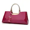Fabricantes moda europea y americana pegamento ligero charol portátil bolso de mujer hombro diagonal bolso de boda bolso de novia banquete