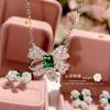 Pendientes de tuerca de lazo de cristal puntiagudo verde transfronterizo de camelia para mujer, chapados en oro con incrustaciones de circonio, cadena para clavícula, traje de tesoro colorido, entrega de una pieza