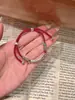 Pulsera trenzada de cordón rojo enrollado estilo chino retro para mujer, Joyería de lujo ligero de alta gama al por mayor