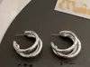 Pendientes de semicírculo hueco de tres capas con temperamento de nicho de viento frío de Europa y Estados Unidos, pendientes de red C con pendientes irregulares pendientes