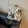 Mochila casual de lunares transfronteriza para mujer, nuevo modelo de verano 2026, mochila escolar para estudiante de gran capacidad con múltiples bolsillos