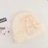 Gorro de lana tejido con lazo de cuerda colorido coreano para mujer, otoño e invierno, adelgazante, cálido, protector de orejas