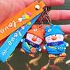 Mochila fofa de desenho animado transfronteiriça chaveiro de pato pingente de bolsa para casal patinho criativo pendurado pequenos presentes atacado