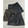 Mini Falda de Cuero Negra MMC Temperamento Segmento Otoño 2026 Costura Segmentada Cintura Alta Falda de Cuero Línea A Falda Adelgazante 63X25293