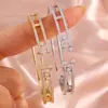 RAKOL Moda Luxo Leve Cobre Incrustado Zircônia Trevo de Quatro Folhas Aberto Ajustável Pulseira Feminina Nicho Toque de Alto Padrão Joia de Mão