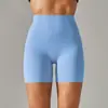 Pantalones de yoga de estilo nuevo sin línea de vergüenza color piel para mujer, cintura alta, realce de glúteos, compresión abdominal, shorts deportivos de tres puntos
