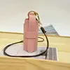 Artículo Popular Transfronterizo: Llavero Redondo para Lipstick, Colgante de Cuero, Accesorio para Bolso de Mujer, Mini Bolsa de Almacenamiento, Bolsita