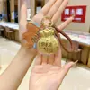 Llavero de Oro Puro 999 Creativo de Moda Colgante de Oro Bolso de Riqueza Diaria Bolsa de la Suerte Encanto Concha de Agua Mismo Estilo