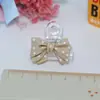 Accesorios de resina con lazo de color Accesorios de pegamento cremoso Tarjeta goo Pinza para el pelo Funda para teléfono móvil Bolsa de materiales hechos a mano para bricolaje
