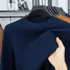 Suéter de lana fina de alta gama lavable a máquina para hombre, otoño e invierno, cuello redondo, engrosado, cálido, color liso, camiseta base de punto de cachemira