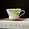 Taza de té de cerámica pintada a mano bajo vidriado de peonía y mariposa con asa, taza de maestro, juego de té kung fu para uso doméstico