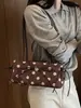 Bolso de axila de lunares estilo coreano, nicho súper popular para mujer, nuevo modelo otoño 2026, bolso de hombro exquisito y elegante, versátil para el trabajo