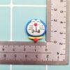 Accesorios de resina para bricolaje con expresión de dibujos animados de cara brillante, serie Doraemon azul, pegamento en crema, funda para teléfono móvil, horquilla, pegatina para refrigerador