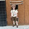 Camisetas para niños y niñas ropa de verano 2026 nuevo moderno genial moda estampado de grafiti popular manga corta pantalones cortos conjunto de dos piezas