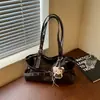 Bolsa de mano retro de nicho transfronteriza de gran capacidad, bolso de hombro casual de nicho nuevo para otoño de 2026, bolso de axila para el trabajo