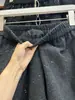 Falda midi de lana mezclada, minimalista y a la moda, con adornos de pedrería, estilo coreano, para mujer, colección otoño 2026, corte holgado, falda versátil de retazos en línea A