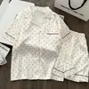 Pijama de verano fino de seda helada para mujer, estilo coreano, dulce y elegante, cárdigan de lunares, shorts de manga corta, ropa de casa moderna, se puede usar afuera