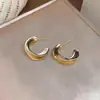 Brincos de tarracha redondos torcidos de agulha prateada moda nicho alta costura simples brincos luxo leve temperamento versátil joia de orelha para mulheres
