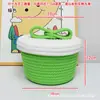 Cesta de almacenamiento tejida hecha a mano al por mayor de fábrica, caja de almacenamiento de color macarrón con tapa, decoración de escritorio para el hogar y organizador de artículos varios