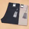 Serie Z Jie Jia Nuevos pantalones casuales de negocios para hombre finos de primavera y verano de Tencel y algodón de fibra larga elásticos lisos sin planchado antiarrugas
