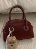 Bolsa de Bolos Portátil para Mujer 2025 Invierno Nueva Moda Retro Bolsa Almohada Viajero de Alto Valor Bolsa Individual