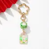 Amuleto estilo INS gato de la suerte de cerámica flor de ciruelo llavero colgante metálico decoración para bolso para buena suerte y salud