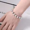 Venta Caliente Europea y Americana Lujo Ligero Alto Sentido del Diseño Perla de Imitación Hecho a Mano con Cuentas Lazo Collar Pulsera Conjunto de Dos Piezas