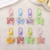 Llavero de mariposa de resina de colores dulces, colgante de hebilla de puerta, producto terminado creativo hecho a mano DIY, decoración de accesorio para bolso