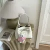 Bolsa de Mão de Luxo Modelo Saco para Mulheres 2026 Primavera Nova Tendência Moda para o Dia a Dia Versátil Ombro Transversal