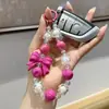Nova corrente de celular com laço de miçangas inspirada na dopamina, um acessório fofo e estiloso para bolsas, e um chaveiro de carro doce e legal para meninas